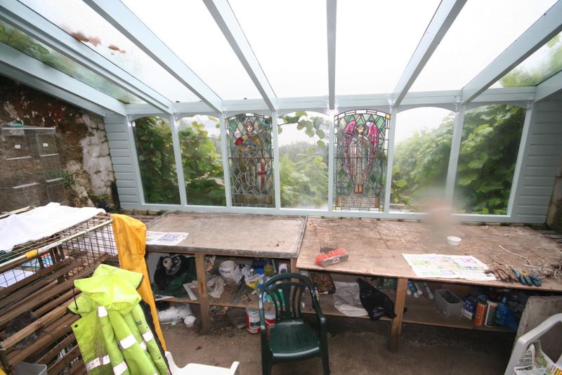 Potting Shed complete with Stained
                    Glass Windows