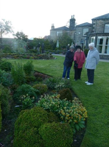 Members admiring
                    one of the borders